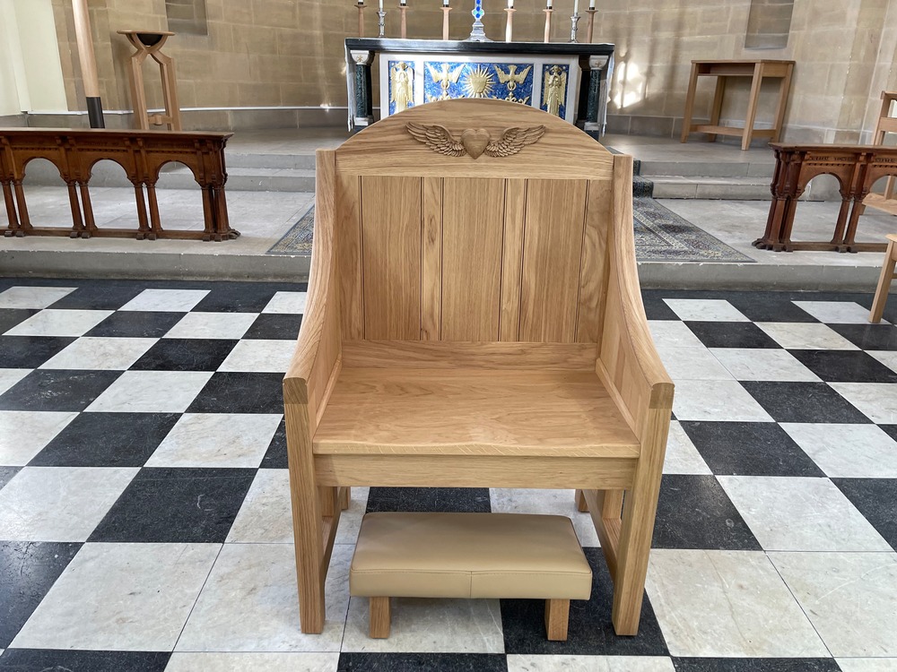Presider's chair with upholstered church kneeler